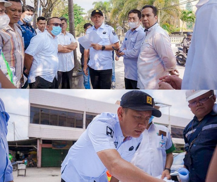 Plt Kepala Dinas PUPR Pekanbaru Edward Riansyah saat meninjau lokasi penurunan tanah akibat bekas galian IPAL di Kecamatan Sukajadi, Rabu (8/3/2023). Foto: Istimewa.