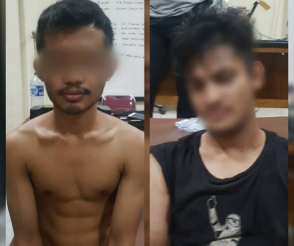 Dua orang pria yang diamankan aparat Polsek Sukajadi, Pekanbaru