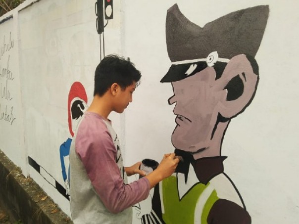 Salah satu peserta lomba mural HUT ke-64 Lalu Lintas di RSDC Rumbai Pekanbaru