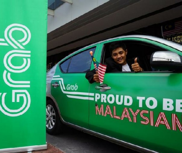 Seorang pengendara transportasi Grab di Malaysia. Foto: Mole.my.