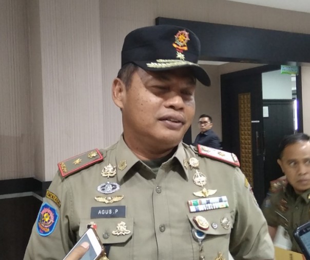 Kepala Satpol PP Pekanbaru Agus Pramono usai rapat dengar pendapat dengan Komisi I DPRD. Foto: Surya/Riau1.