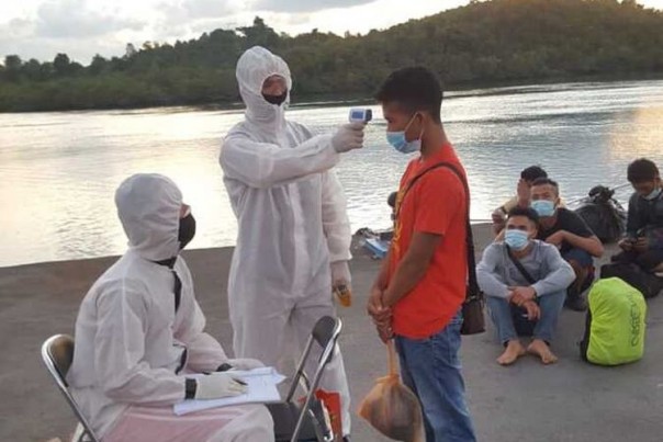 Masuknya Pekerja Migran Indonesia dari Malaysia Ditengah Seruan Untuk Tetap Tinggal Dirumah Dalam Menghadapi Pandemi Virus Corona