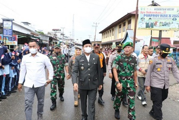 Plt Bupati Kuansing memasuki tempat pembukaan Pra TMMD